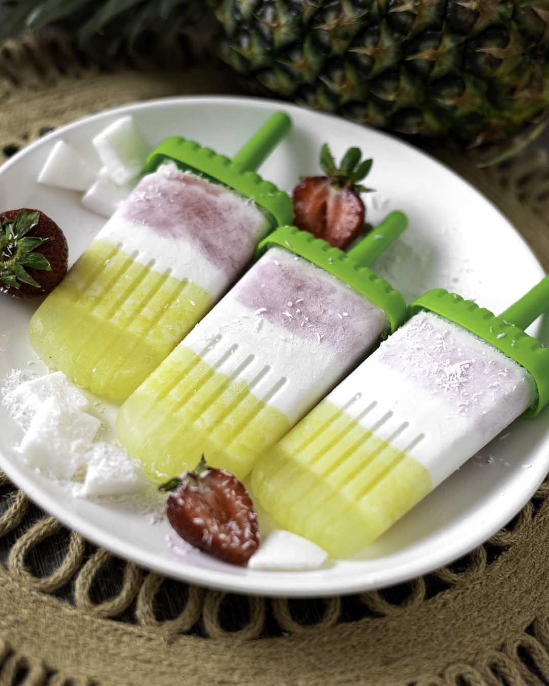 pina colada popsicles on plate