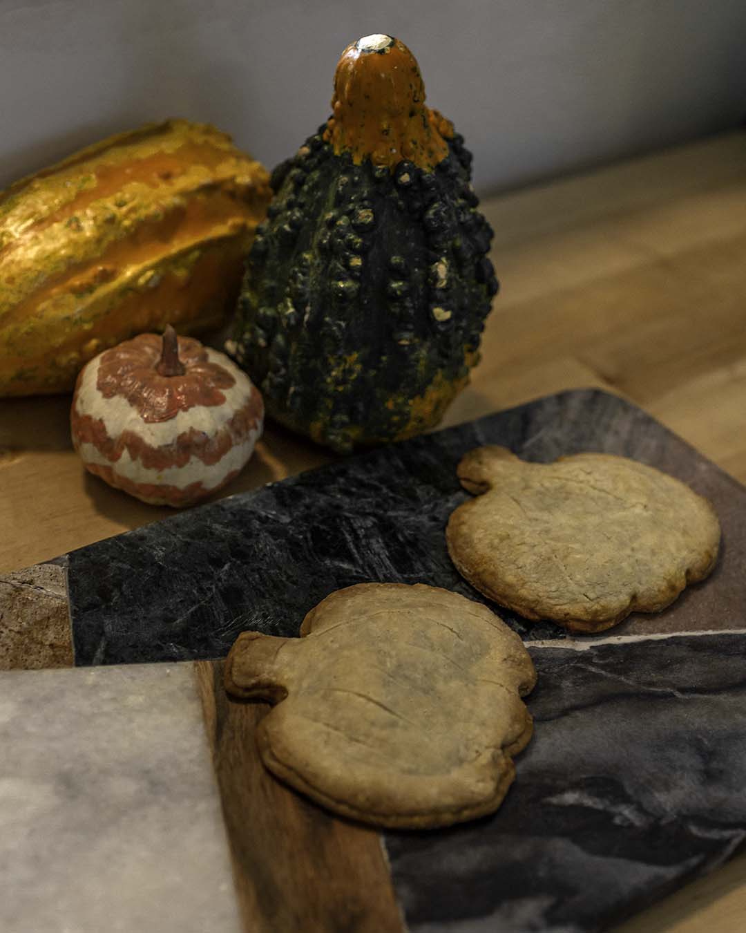 pumpkin cookies on cutting board