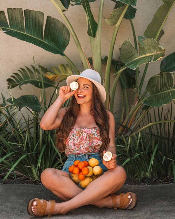 girl with bowl of citrus fruit