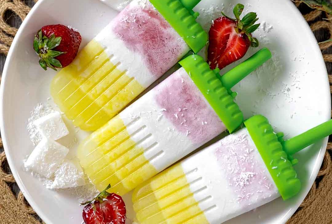 Layered Strawberry Piña Colada Popsicles (Dairy-free!)